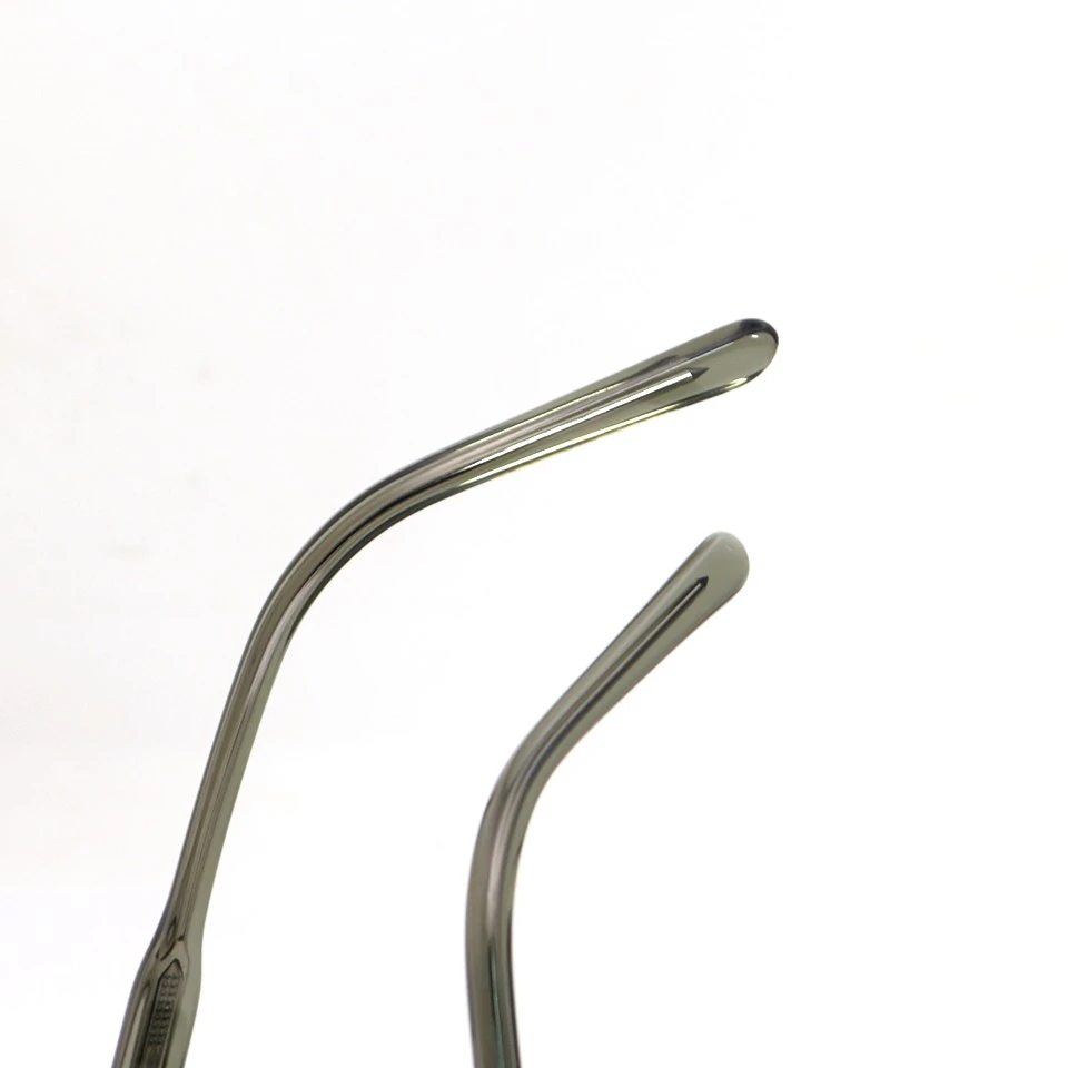 Close-up of acetate temple tip on translucent olive green sunglasses Close-up of acetate temple tip on translucent olive green sunglasses