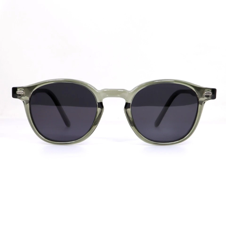 Round acetate polarized sunglasses in translucent olive green, front angle view Round acetate polarized sunglasses in translucent olive green, front angle view